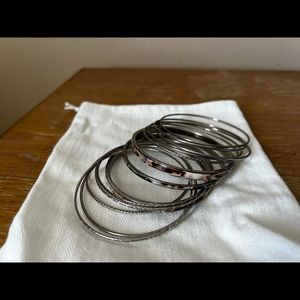 Stack of silver colored bangles